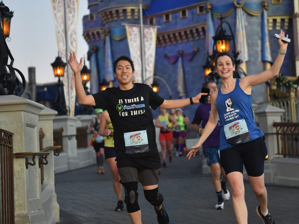 Running through Magic Kingdom castle during Disney Marathon